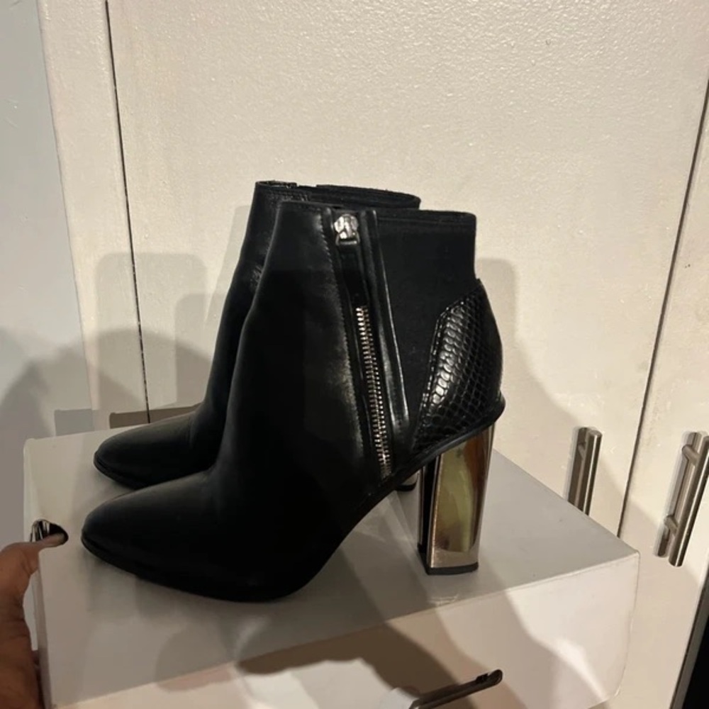 Chic Black Heeled Boots with Silver Detail